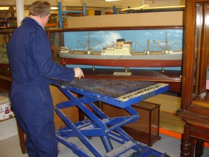 Model on scissor lift table